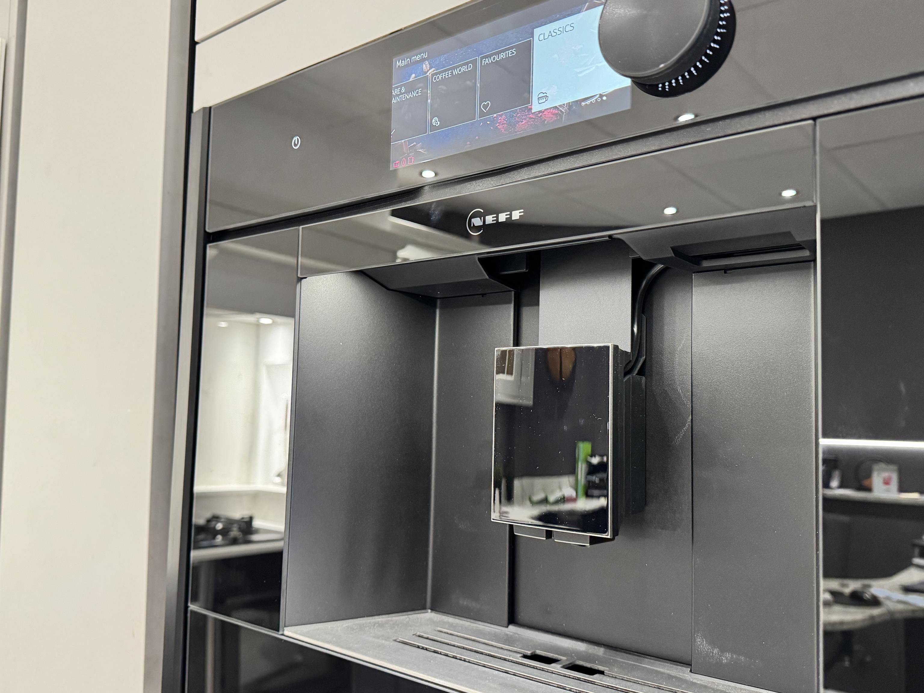 Kitchen worktop surface and wine champagne fridge with door open